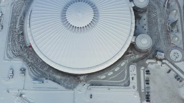 Top view in winter of a modern sports complex with parking in Minsk. Belarus alt