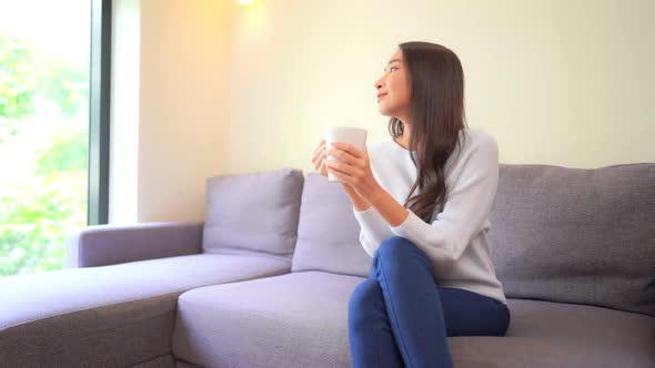 Young asian woman with coffee cup