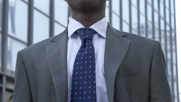 confident young African black manager in the street. Challenge, success alt