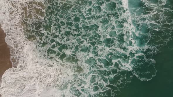 Afternoon camera down drone view from the water and deeply waves of Redondo Beach, California. ( DJi alt
