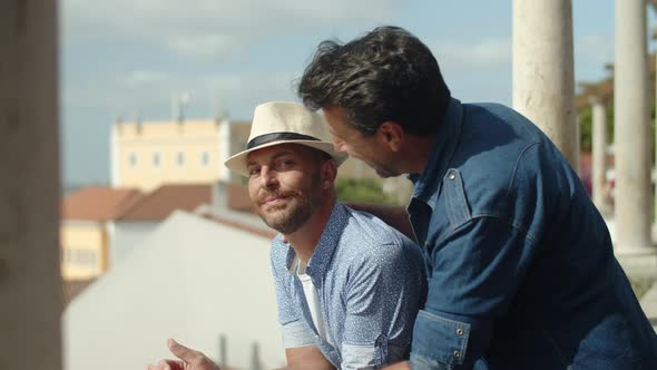 Slow Motion of Happy Gay Couple Looking at City From View Point alt