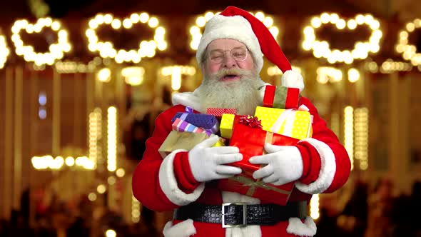 Santa Holding Presents and Laughing alt