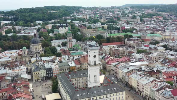 Rynok Square In Lviv Ukraine With The Ukrainian Flag Flying On Top Of A