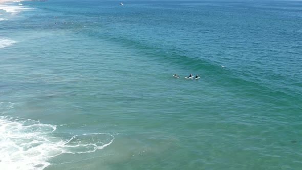 Aerial Of Surfer Catching A Wave