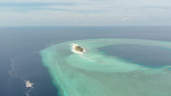 Aerial: Flying over idyllic atoll, Wakatobi Marine National Park Indonesia alt