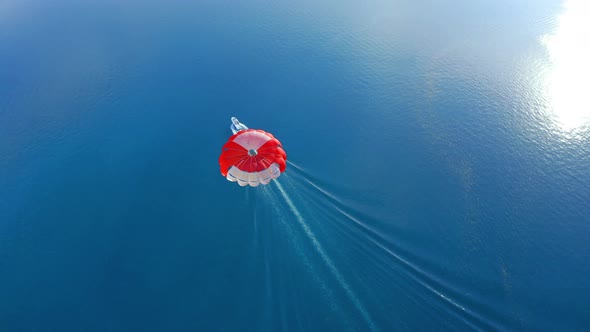 Aerial Shot of south male atoll with paraglider