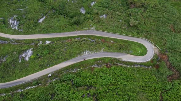 Aerial View of Moving Cars on a Mountain Road