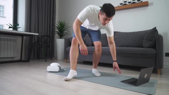 Mindfulness Cheerful Man in Virtual Reality Glasses Meditates in the Living Room Modern Technology alt