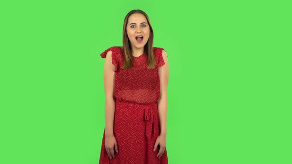 Tender Girl in Red Dress with Wow Facial Expression and Tender Smiling. Green Screen alt