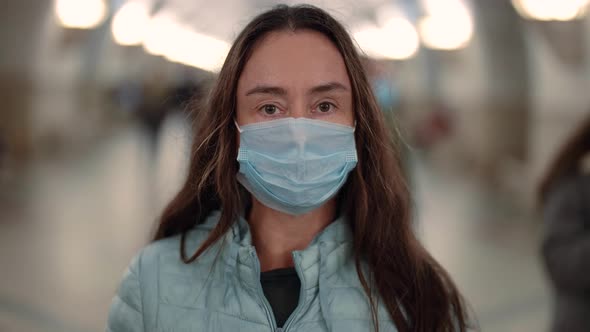 Female Passenger of Underground with Protective Face Mask in Pandemic of Coronavirus alt