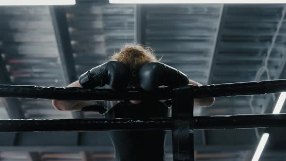 Apathetic Sportsman Standing at Gym. Confused Fighter Losing Battle on Ring alt