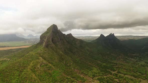 Shooting From Top to Bottom the Peaks of Mountains and Jungles of Mauritius the Sky in Clouds