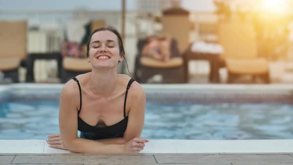 Girl After Swimming Posing in the Pool alt