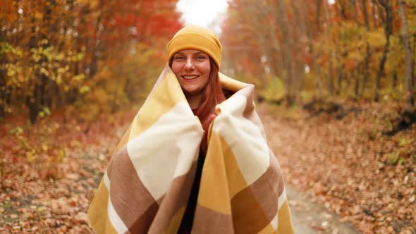 Closeup Portrait of Beautiful Girl Traveler Wraps in Yellow Scarf Walking Outdoors in Autumn Park