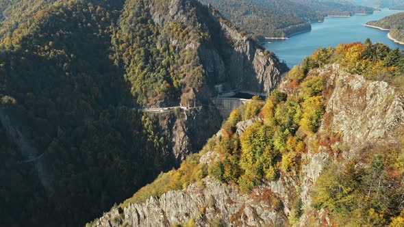 Aerial drone view of nature in Romania. Valley in Carpathian mountains with Vidraru dam and lake alt