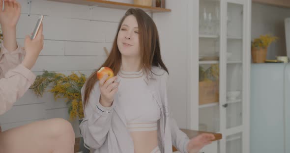 Lesbians are taking selfies while eating Lesbians are taking selfies in the kitchen LGBT Bisexual alt