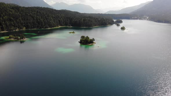 beautiful drone video of an lake and mountains, eibsee in bavaria alt
