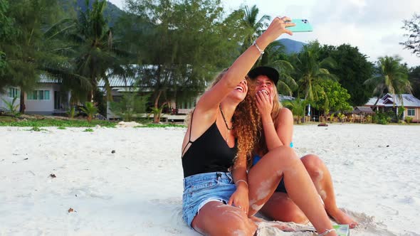 lovely girls influencers vlogging on summer vacation. Beautiful Thailand coast, funny women and mode alt