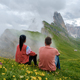 couple on vacation hiking in the Italian Dolomites, Amazing view on Seceda peak. Trentino Alto Adige - PhotoDune Item for Sale