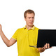 Puzzled young man with laptop pointing with finger isolated on white background, male confused face - PhotoDune Item for Sale