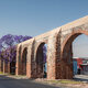 Queretaro Mexico aqueduct with jacaranda tree and purple flowers - PhotoDune Item for Sale