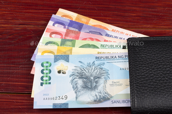Philippine peso in the black wallet - Stock Photo - Images