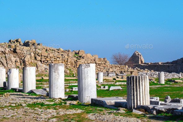 Ruins of columns in ancient city of Pergamon in sunny day. Bergama, Turkey. - Stock Photo - Images
