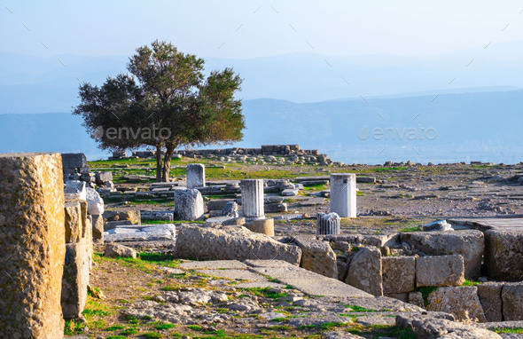 Ruins of columns in ancient city of Pergamon in sunny day. Bergama, Turkey. - Stock Photo - Images