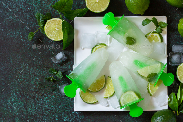 Summer refreshing homemademojito popsicles with lime juice and mint, mojito fruit ice.  - Stock Photo - Images