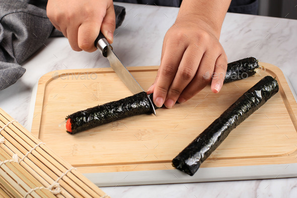Female Home Maker Cut Rolled Laver or Nori Seaweed with Glass Noodle Inside