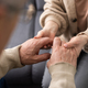 Two people holding hand together. elderly man and support woman - PhotoDune Item for Sale