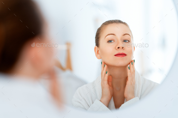 woman with cream for her face - Stock Photo - Images
