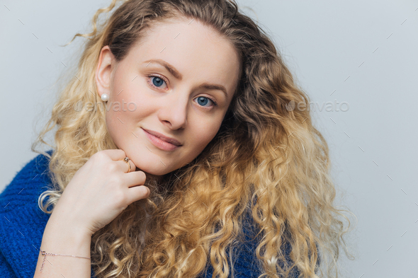 Headshot Of Adorable Blue Eyed Female Model With Curly Hair Blue Eyes