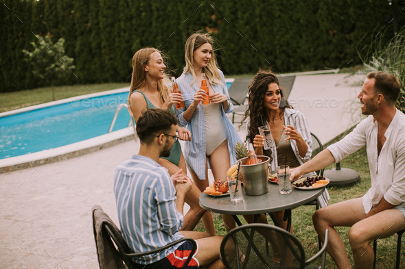 Young people have Summer Celebration of Food, Drink, and Friendship - Stock Photo - Images