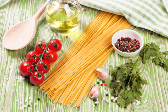 Pasta And Cooking Ingredients On Green Wooden Background. - Stock Photo - Images