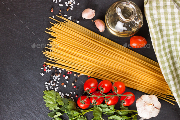 Pasta And Cooking Ingredients On Black Slate Background. - Stock Photo - Images