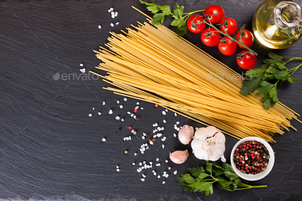Pasta And Cooking Ingredients On Black Slate Background. - Stock Photo - Images