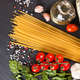 Pasta And Cooking Ingredients On Black Slate Background. - PhotoDune Item for Sale