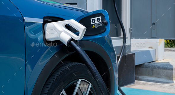 Car charging at electric car charging station. Electric vehicle charger station for charge battery. - Stock Photo - Images