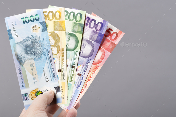 Philippine money on a gray background - Stock Photo - Images