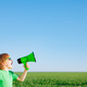 Happy child shouting through loudspeaker against blue summer sky - PhotoDune Item for Sale