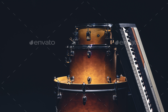 Drums and musical keys on a black background isolated. - Stock Photo - Images