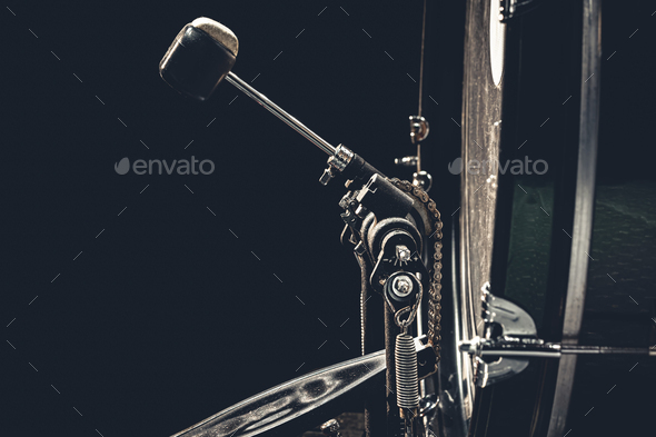 Bass drum with pedal, musical instrument on black background. - Stock Photo - Images
