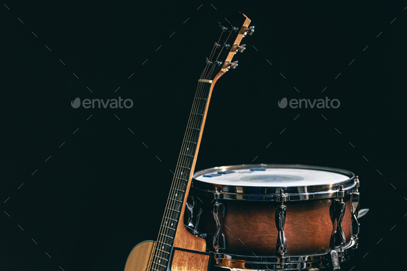 Acoustic guitar and snare drum on a black background isolated. - Stock Photo - Images