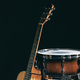 Acoustic guitar and snare drum on a black background isolated. - PhotoDune Item for Sale