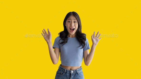 Asian woman posing extremely happy to win - Stock Photo - Images