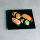 traditional sushi with salmon, eel and tuna on black plate - PhotoDune Item for Sale