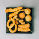 deep-fried calamari and rise with fish on black plate - PhotoDune Item for Sale