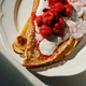 Close up pancakes with sour cream and berries on a plate - PhotoDune Item for Sale