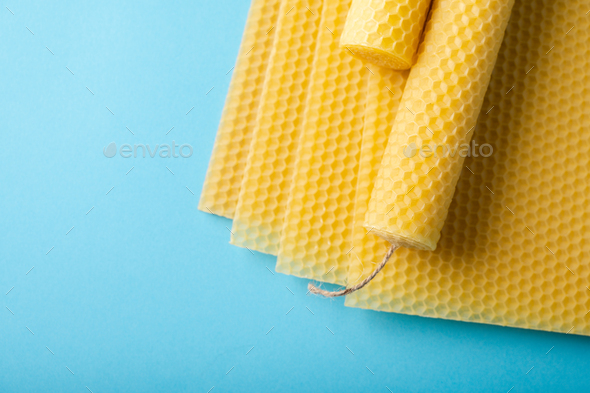 Beeswax honeycomb sheets and candles - Stock Photo - Images